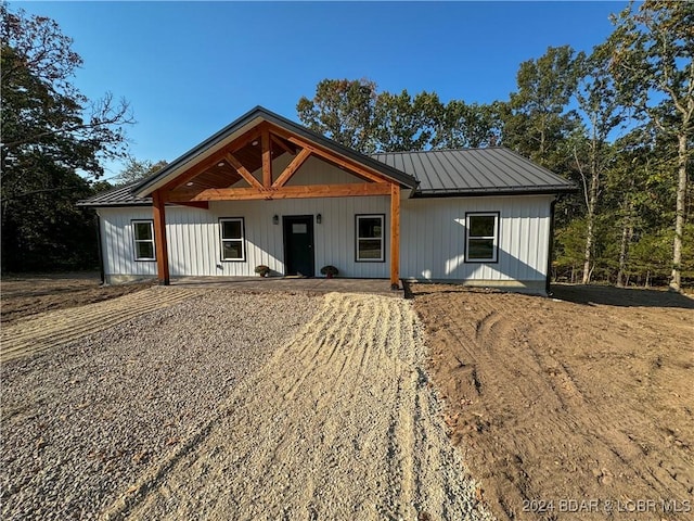 modern inspired farmhouse with a standing seam roof and metal roof