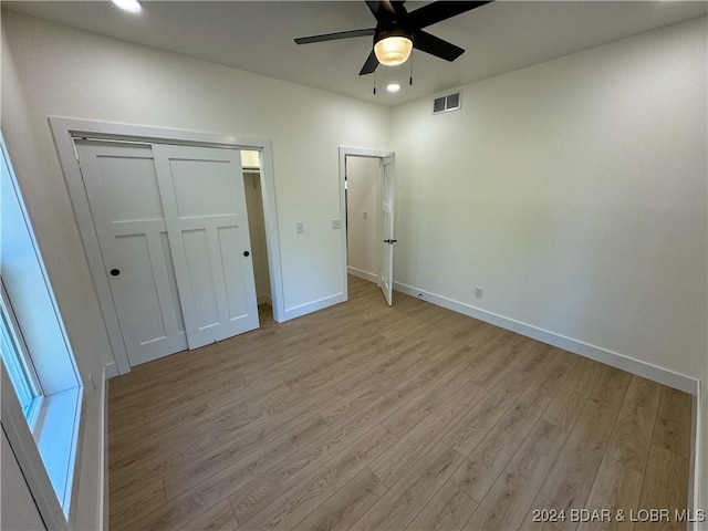 unfurnished bedroom with light wood-style floors, baseboards, visible vents, and recessed lighting