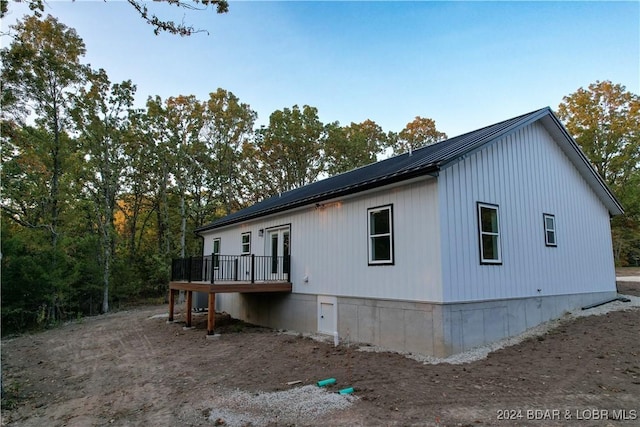 view of home's exterior featuring a wooden deck