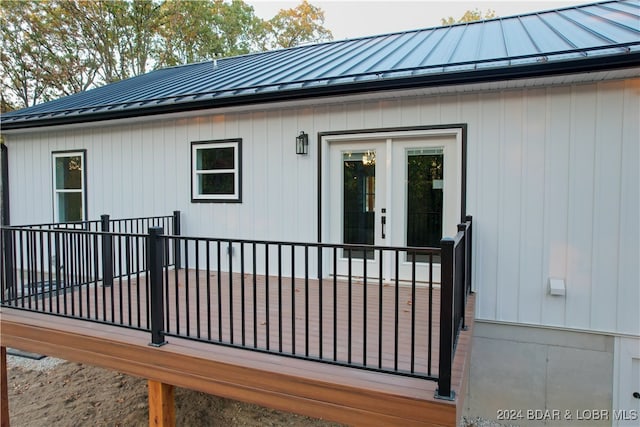 back of property with metal roof and a standing seam roof