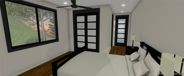 bedroom with multiple windows and dark hardwood / wood-style flooring