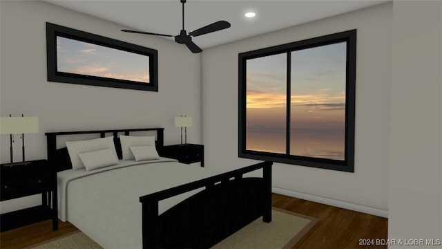 bedroom with dark wood-type flooring and ceiling fan