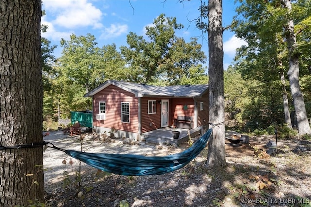 back of house featuring a patio, cooling unit, and a wooden deck