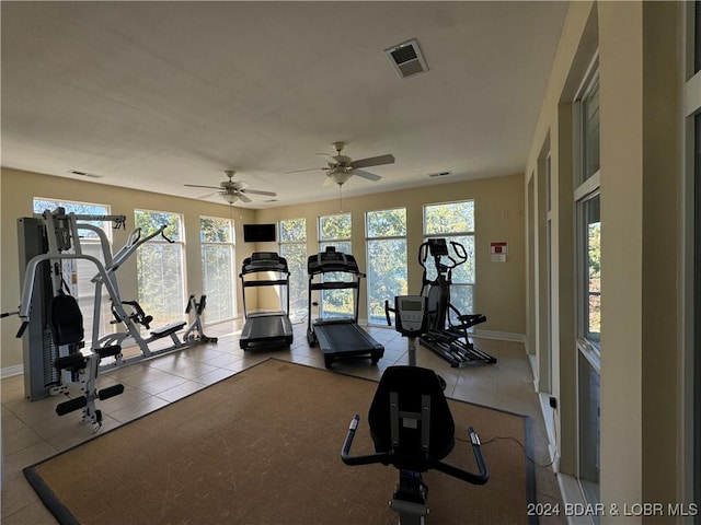 workout area featuring tile patterned floors and ceiling fan