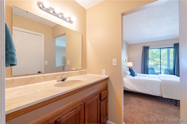 bathroom with vanity and a textured ceiling