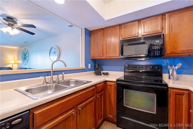 kitchen featuring light tile patterned flooring, ceiling fan, sink, black appliances, and a textured ceiling