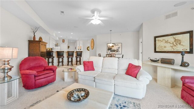 living room featuring ceiling fan