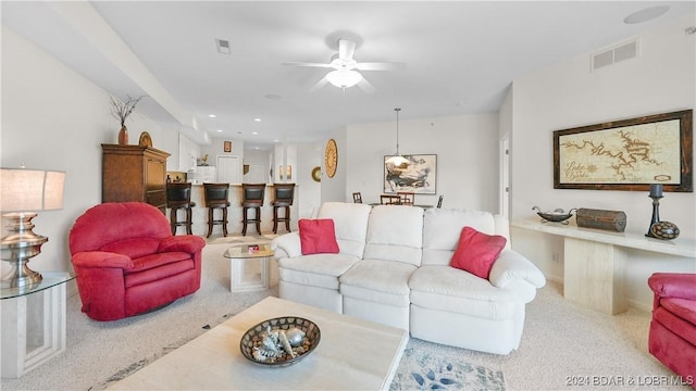 living room featuring ceiling fan, visible vents, and recessed lighting