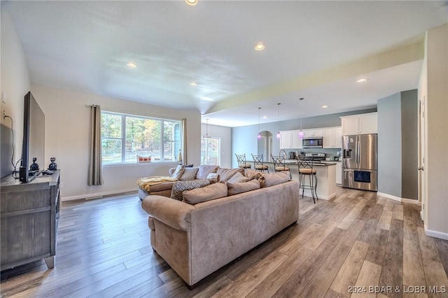 living room with light hardwood / wood-style flooring