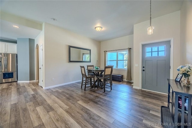 dining space with dark hardwood / wood-style flooring