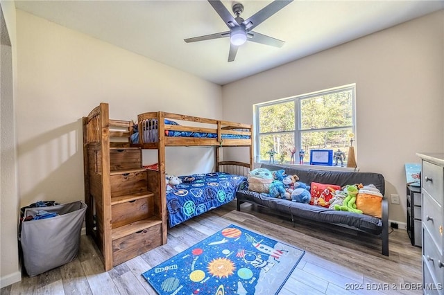 bedroom featuring hardwood / wood-style flooring and ceiling fan