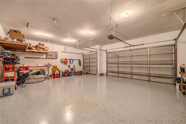 garage featuring a garage door opener