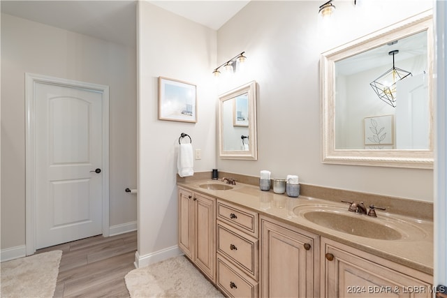 bathroom featuring vanity and hardwood / wood-style floors