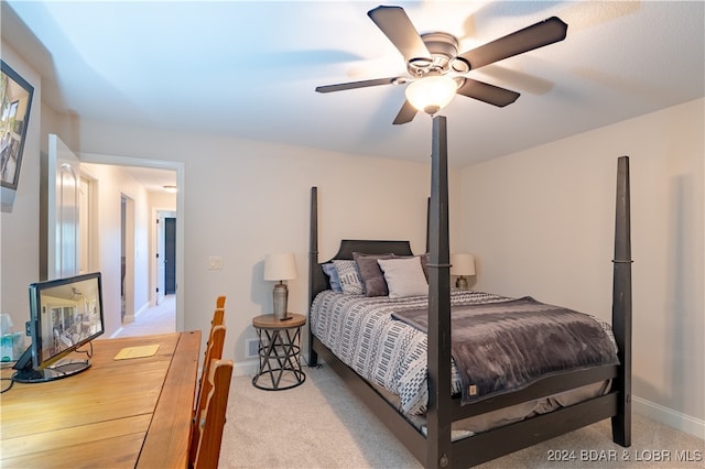 bedroom with ceiling fan and light carpet