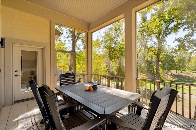 sunroom / solarium with wooden ceiling