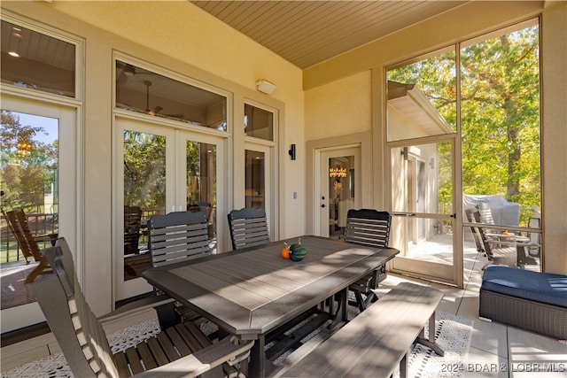 sunroom featuring french doors and wood ceiling