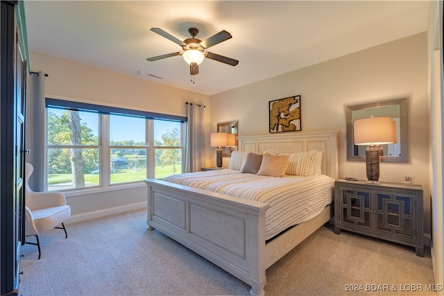 bedroom featuring ceiling fan and light colored carpet