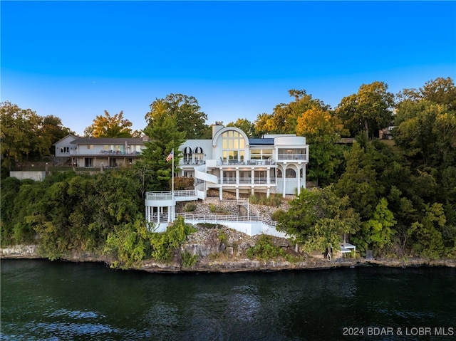 back of house featuring a water view