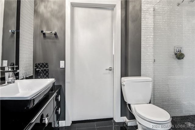 bathroom with vanity, tile patterned flooring, and toilet