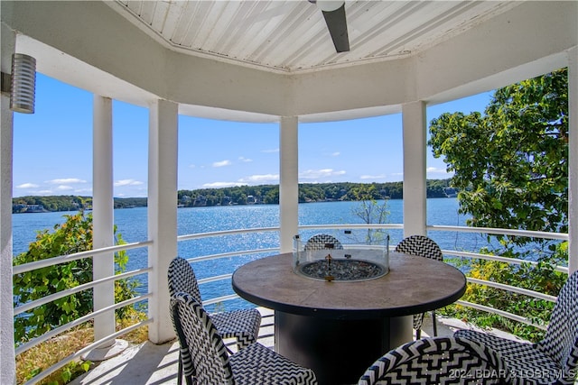 sunroom / solarium with a water view