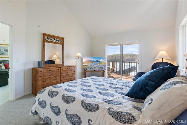 bedroom with access to exterior, vaulted ceiling, baseboards, and light colored carpet