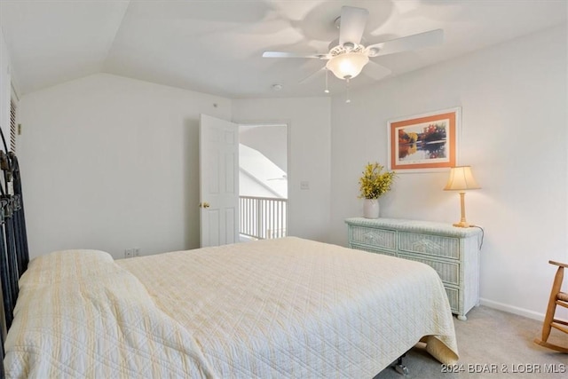 bedroom with lofted ceiling, ceiling fan, baseboards, and carpet flooring