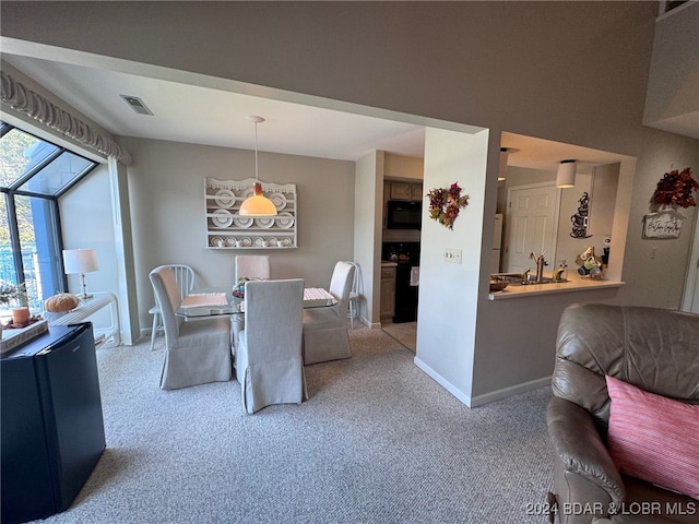 view of carpeted dining area