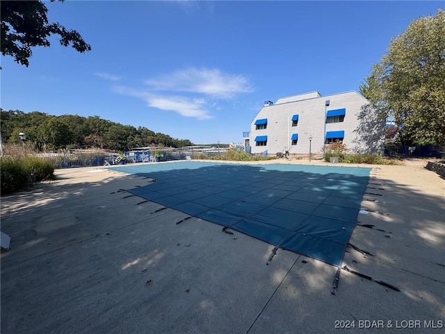 view of swimming pool with a patio area