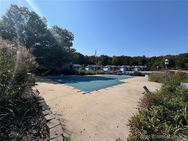 view of swimming pool with a patio area