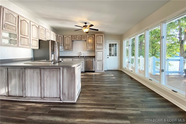 kitchen featuring stainless steel fridge, dark hardwood / wood-style flooring, ceiling fan, and sink