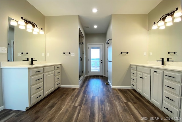 bathroom featuring vanity, wood-type flooring, and walk in shower