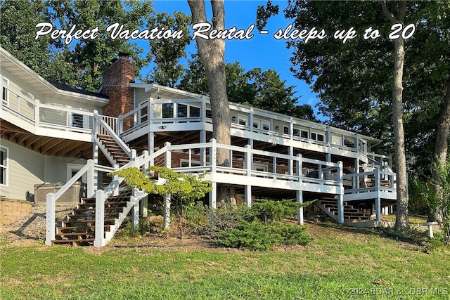 back of property featuring a deck and a lawn