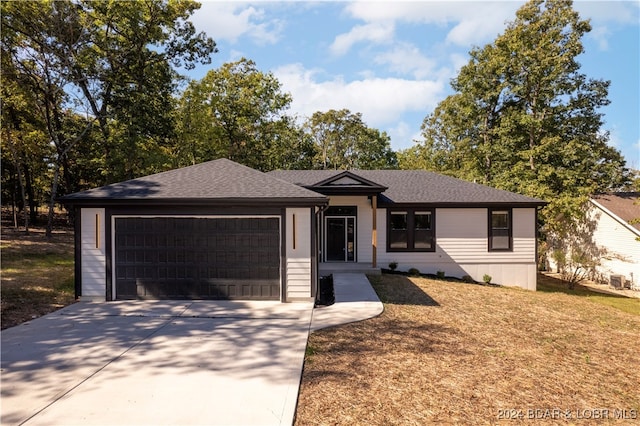 view of front facade with a garage and a front yard