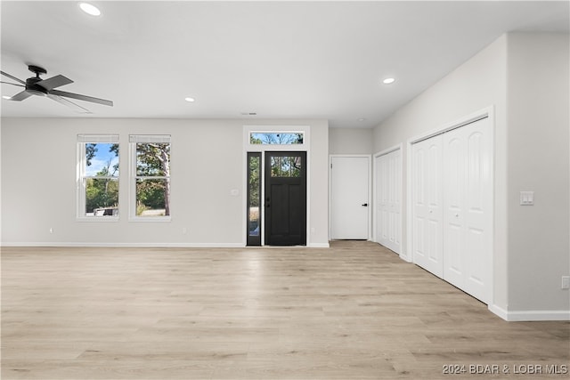 entryway featuring ceiling fan and light hardwood / wood-style flooring