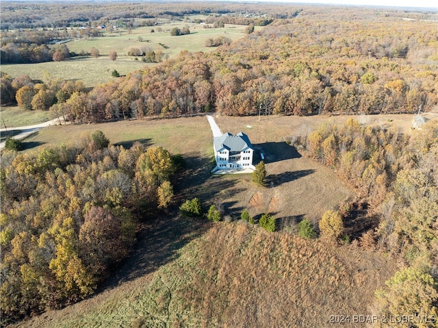 birds eye view of property with a rural view