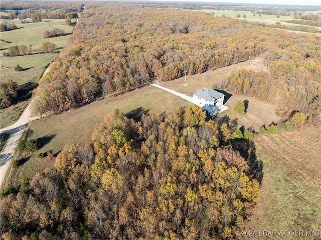 birds eye view of property with a rural view