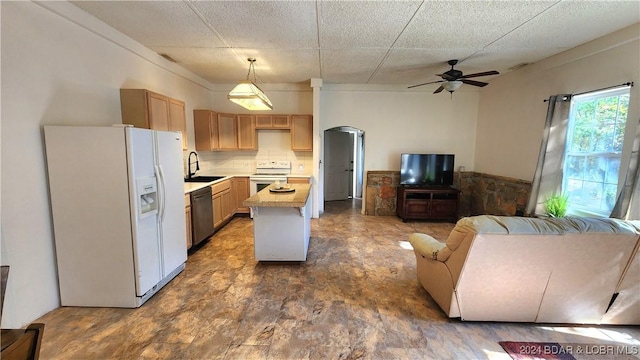 kitchen with light brown cabinetry, white appliances, ceiling fan, sink, and pendant lighting