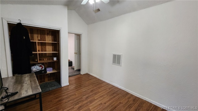 interior space featuring wood-type flooring and vaulted ceiling