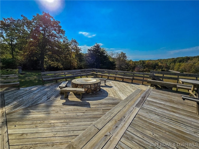 deck featuring an outdoor fire pit