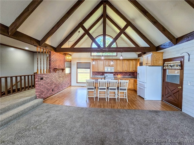 kitchen featuring light hardwood / wood-style floors, beam ceiling, white appliances, and tasteful backsplash