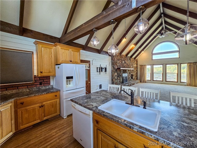 kitchen featuring pendant lighting, high vaulted ceiling, white appliances, and sink