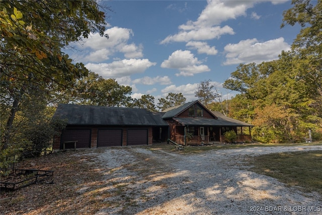 view of front facade with a garage and covered porch