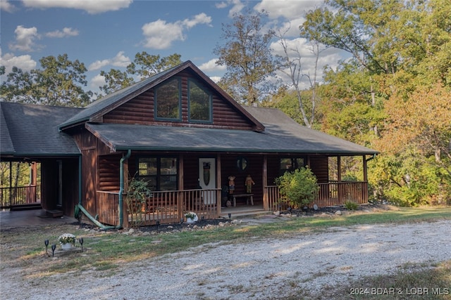 log cabin featuring a porch