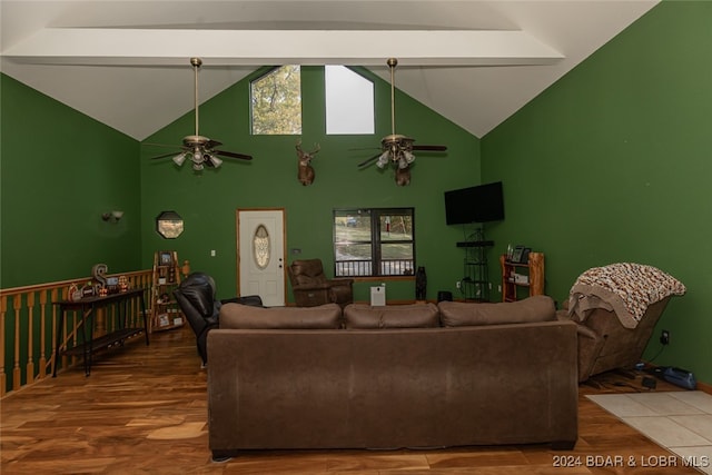 living room featuring high vaulted ceiling, hardwood / wood-style floors, and beam ceiling