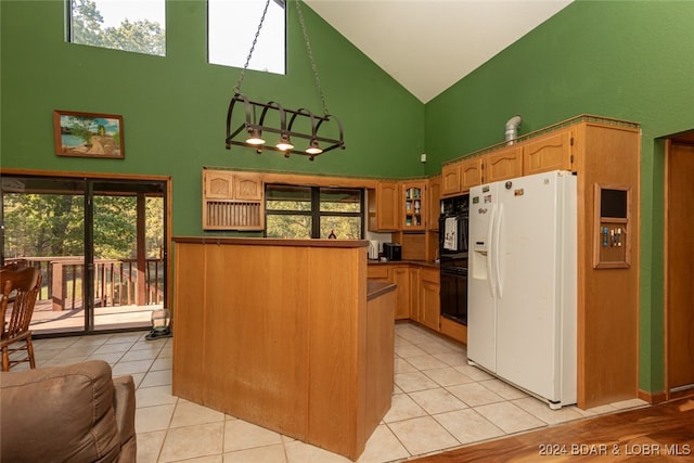 kitchen with white fridge with ice dispenser, double oven, high vaulted ceiling, and a healthy amount of sunlight