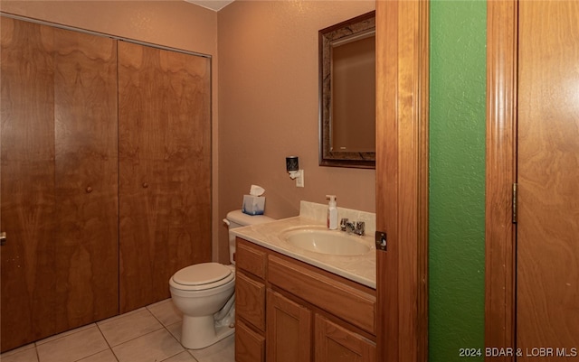 bathroom with tile patterned floors, vanity, and toilet