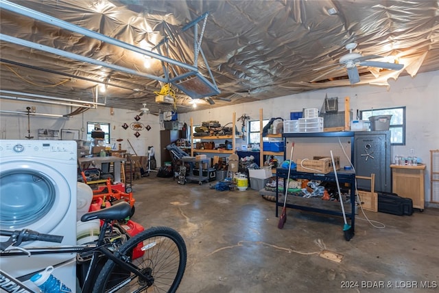 garage with ceiling fan, washer / clothes dryer, and a workshop area