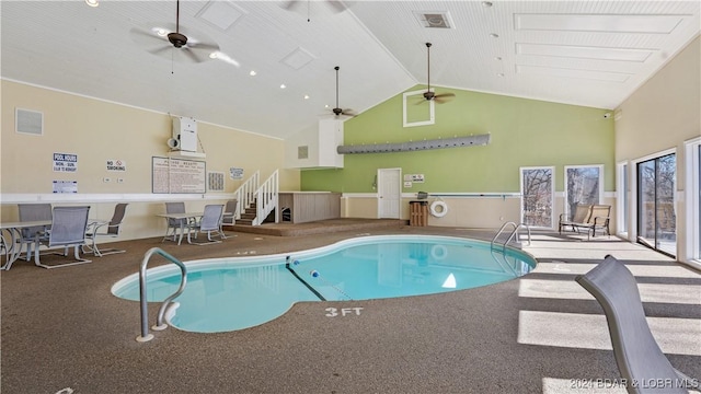 view of swimming pool featuring ceiling fan