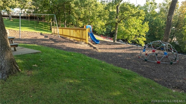 view of playground featuring a lawn