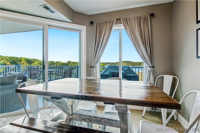 dining space with a water view